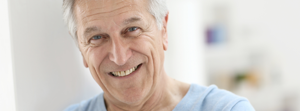 old man smiling at camera